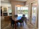 Cozy dining area with pool view through the large window at 2041 Gold Dust Ct, Trinity, FL 34655