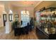 Elegant dining room featuring stylish chandelier and plenty of room at 2041 Gold Dust Ct, Trinity, FL 34655