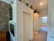 Hallway featuring decorative accents, built-in shelves, and access to the main bedroom at 2041 Gold Dust Ct, Trinity, FL 34655