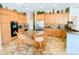 Bright kitchen with stainless steel appliances, large island with cooktop, granite countertops, and custom cabinetry at 2041 Gold Dust Ct, Trinity, FL 34655