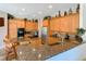 Kitchen boasts granite countertops, stainless appliances, gas cooktop, and ample cabinet space for culinary enthusiasts at 2041 Gold Dust Ct, Trinity, FL 34655