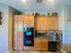 The kitchen features stainless appliances, custom cabinets, granite countertops, and provides ample storage at 2041 Gold Dust Ct, Trinity, FL 34655