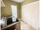 Laundry room with modern machines, window and ample closet space at 2041 Gold Dust Ct, Trinity, FL 34655