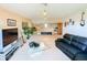 Spacious living room with ample lighting, comfortable seating, and a TV, creating an inviting space at 2041 Gold Dust Ct, Trinity, FL 34655