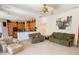 Spacious living room open to the kitchen with fan and carpeted floors at 2041 Gold Dust Ct, Trinity, FL 34655