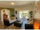 Open living room with sliding doors and hardwood style flooring at 2041 Gold Dust Ct, Trinity, FL 34655