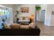 Well-lit living room with hardwood-style flooring and pool views at 2041 Gold Dust Ct, Trinity, FL 34655
