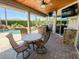 Covered patio with a ceiling fan, a built-in grill, and outdoor seating, perfect for entertaining at 2041 Gold Dust Ct, Trinity, FL 34655