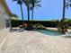 Beautiful backyard pool and patio area with lush landscaping and a tranquil waterfall feature at 2041 Gold Dust Ct, Trinity, FL 34655