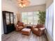 Cozy sitting area featuring wood-look floors and ample natural light at 2041 Gold Dust Ct, Trinity, FL 34655