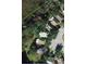 Aerial view of property boundaries and surrounding neighborhood, showing lot size at 22443 Crows Nest Ct, Lutz, FL 33549