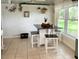 Cozy eat-in kitchen with built-in seating, a view to the outdoors and natural lighting at 22443 Crows Nest Ct, Lutz, FL 33549