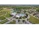 An aerial view showcases the community pool, clubhouse, tennis courts, and playground at 22489 Storybook Cabin Way, Land O Lakes, FL 34637