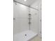 Bright bathroom featuring a tiled shower with shower head at 22489 Storybook Cabin Way, Land O Lakes, FL 34637
