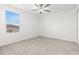 Bedroom featuring neutral carpet, ceiling fan, and natural light from the window at 22489 Storybook Cabin Way, Land O Lakes, FL 34637