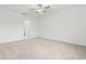 Spacious bedroom with ceiling fan and ensuite bathroom at 22489 Storybook Cabin Way, Land O Lakes, FL 34637