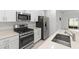 Close up of kitchen with stainless steel appliances and countertop at 22489 Storybook Cabin Way, Land O Lakes, FL 34637