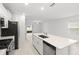 Kitchen island view overlooking the living room and backyard at 22489 Storybook Cabin Way, Land O Lakes, FL 34637