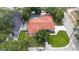 Aerial view of the home, showing a spacious backyard with a pool and beautiful landscaping at 2306 S San Jose Cir, Tampa, FL 33629