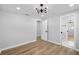 Bedroom with wood-look tile floors and ensuite bathroom at 2306 S San Jose Cir, Tampa, FL 33629