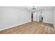 A bright bedroom with wood-look tile flooring leads to the bathroom and closet at 2306 S San Jose Cir, Tampa, FL 33629