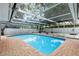Sparkling pool featuring a screened enclosure and brick pavers at 2306 S San Jose Cir, Tampa, FL 33629