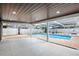 Screened-in pool area with stylish tile flooring and covered patio offers a refreshing outdoor retreat at 2306 S San Jose Cir, Tampa, FL 33629