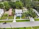 An aerial view showcases the property with its well-maintained lawn, landscaping, and neighborhood setting at 2312 Highland S St, St Petersburg, FL 33705