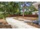 The backyard has mature trees and a wood fence around the perimeter at 2312 Highland S St, St Petersburg, FL 33705
