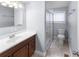 Bathroom featuring a vanity, and a walk-in glass-enclosed shower at 2312 Highland S St, St Petersburg, FL 33705