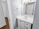 Bathroom featuring white vanity and mirror with decorative lighting fixture at 2312 Highland S St, St Petersburg, FL 33705
