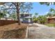 Charming two-story home with a spacious driveway and mature landscaping providing shade at 2312 Highland S St, St Petersburg, FL 33705