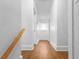Bright hallway with wood floors features two doors and a window at the end of the hall at 2312 Highland S St, St Petersburg, FL 33705