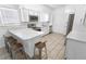 Modern kitchen with white cabinetry, stainless steel appliances, and a breakfast bar at 2312 Highland S St, St Petersburg, FL 33705