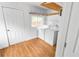 Functional laundry room with washer, dryer, window, and laminate flooring at 2312 Highland S St, St Petersburg, FL 33705