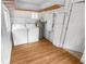 Spacious laundry area with washer, dryer, and additional storage shelves at 2312 Highland S St, St Petersburg, FL 33705
