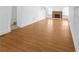 Open living room with hardwood floors, fireplace, and white walls with decorative trim at 2312 Highland S St, St Petersburg, FL 33705