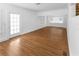 Spacious living room with gleaming hardwood floors, white trim, and abundant natural light at 2312 Highland S St, St Petersburg, FL 33705