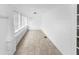 Bright sunroom with neutral tile flooring, white walls, and ample natural light at 2312 Highland S St, St Petersburg, FL 33705