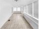 Light-filled sunroom featuring neutral tile flooring, white walls, and windows at 2312 Highland S St, St Petersburg, FL 33705