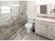 Bright bathroom featuring walk-in shower, toilet, and vanity with modern countertop at 2315 E 12Th Ave, Tampa, FL 33605
