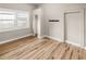 Bright bedroom features wood flooring, large window and closet space at 2315 E 12Th Ave, Tampa, FL 33605