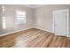 Cozy bedroom with wood flooring, large window and white trim at 2315 E 12Th Ave, Tampa, FL 33605