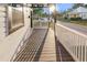 View of the front porch with a white fence, wood flooring and view of neighborhood street at 2315 E 12Th Ave, Tampa, FL 33605