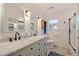 Bright bathroom features double vanity with marble countertop, two mirrors, and a separate toilet area at 2519 1St N Ave, St Petersburg, FL 33713