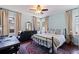 Bedroom with hardwood floors, black furniture, and a ceiling fan at 2519 1St N Ave, St Petersburg, FL 33713