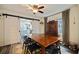 Elegant dining room with stylish furniture, eye-catching light fixture, and seamless flow to kitchen at 2519 1St N Ave, St Petersburg, FL 33713