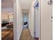Hallway leading to a living room with hardwood floors and neutral paint at 2519 1St N Ave, St Petersburg, FL 33713