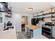 Open kitchen with stainless appliances, butcher block island, and adjacent dining area at 2519 1St N Ave, St Petersburg, FL 33713