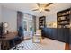 Home office features gray walls, stylish carpet, ceiling fan, and shelving at 2519 1St N Ave, St Petersburg, FL 33713